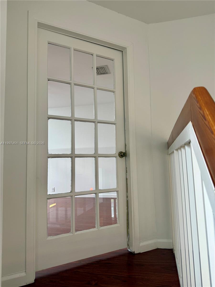9435 Southwest 140th Court, Unit 9435 Miami, FL 33186 - Photo 28 of 33 a view of empty room with wooden floor and fan