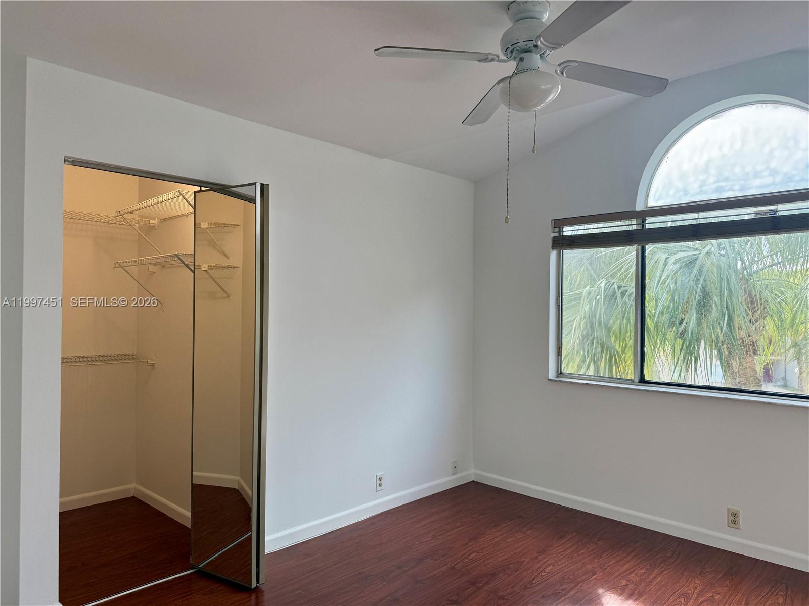 9435 Southwest 140th Court, Unit 9435 Miami, FL 33186 - Photo 31 of 33 an empty room with a window