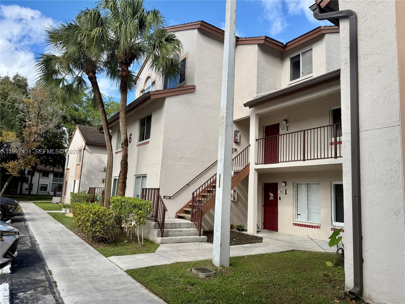 9435 Southwest 140th Court, Unit 9435 Miami, FL 33186 - Photo 7 of 33 front view of a house with a yard