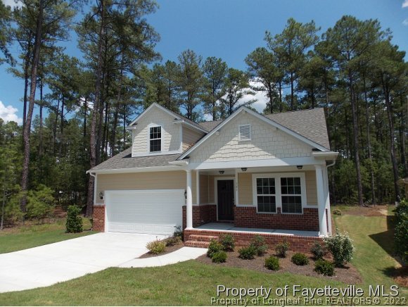 344 Kerr Lake Road Aberdeen, NC 28315 - Photo 1 of 25 a front view of a house with a yard