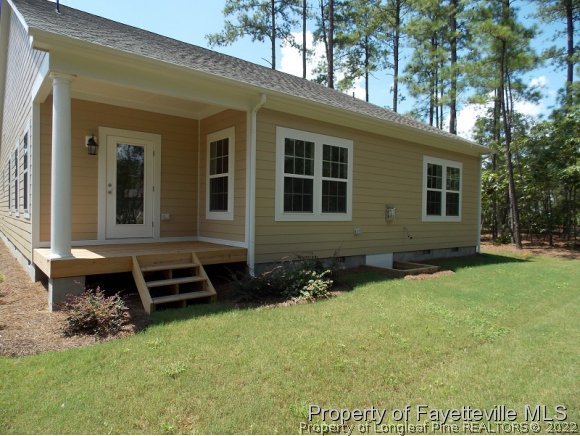 344 Kerr Lake Road Aberdeen, NC 28315 - Photo 20 of 25 a front view of a house with a yard