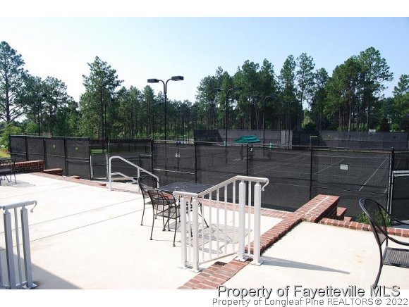 344 Kerr Lake Road Aberdeen, NC 28315 - Photo 25 of 25 a view of a swimming pool with a patio