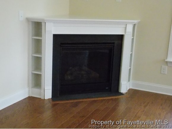 344 Kerr Lake Road Aberdeen, NC 28315 - Photo 3 of 25 a living room with a fireplace