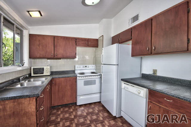 2836 B Road Grand Junction, CO 81503 - Photo 14 of 29 a kitchen with a sink stove and refrigerator