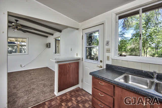 2836 B Road Grand Junction, CO 81503 - Photo 15 of 29 a kitchen with a sink stove and cabinets