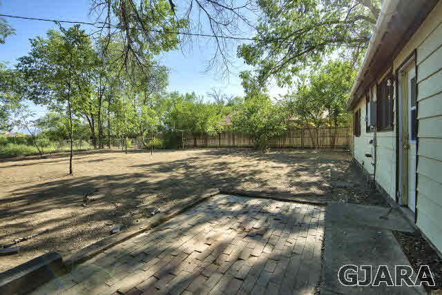2836 B Road Grand Junction, CO 81503 - Photo 22 of 29 a view of a yard with plants and trees
