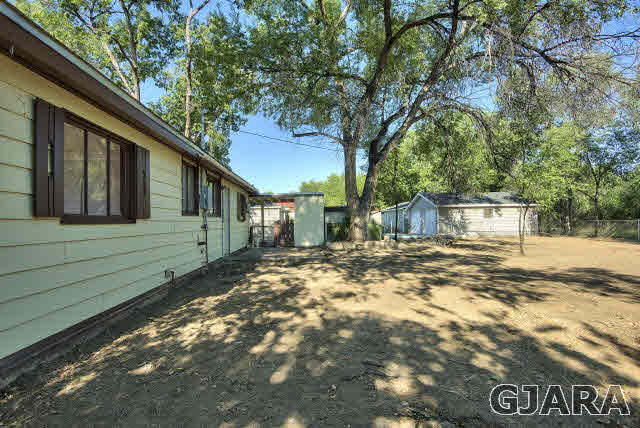 2836 B Road Grand Junction, CO 81503 - Photo 23 of 29 a view of a house with a yard