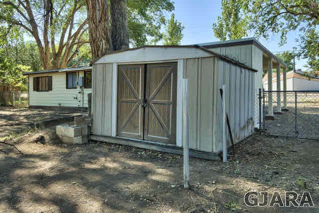 2836 B Road Grand Junction, CO 81503 - Photo 27 of 29 a view of a small house with wooden fence