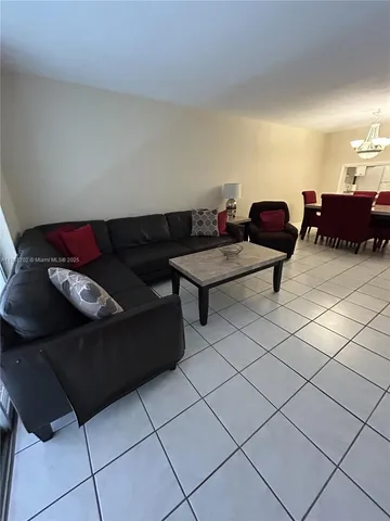 a living room with furniture and a table