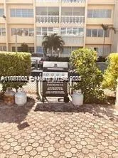 a view of building with outdoor seating