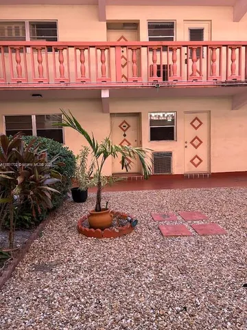 a front view of a house with parking