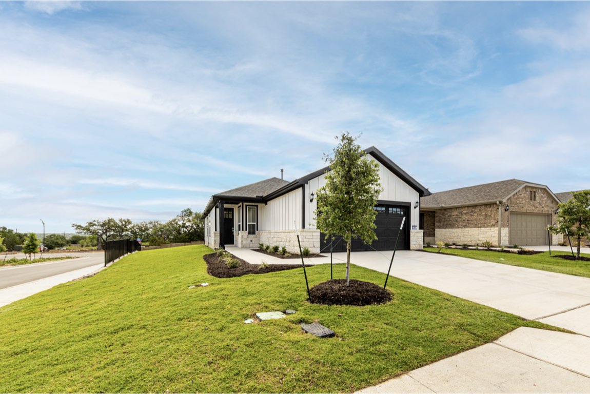 201 Coachsmith Street Georgetown, TX 78633 - Photo 2 of 32 a front view of house with yard and green space