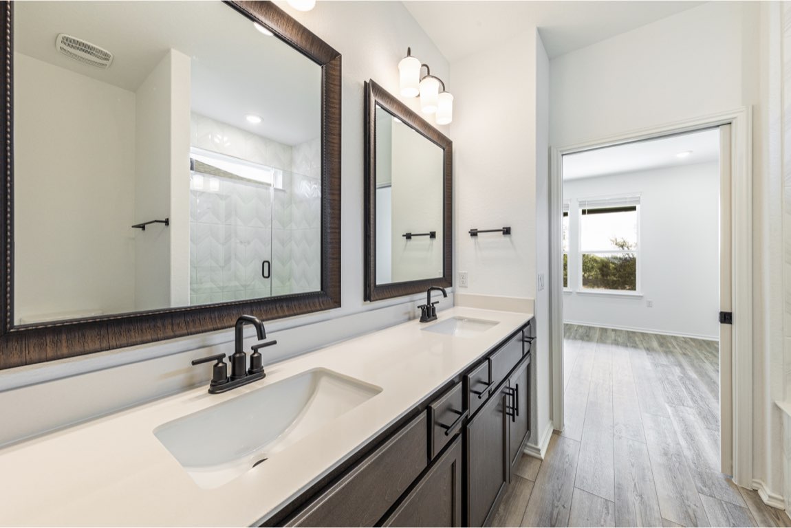 201 Coachsmith Street Georgetown, TX 78633 - Photo 21 of 32 a bathroom with a sink double vanity and a mirror