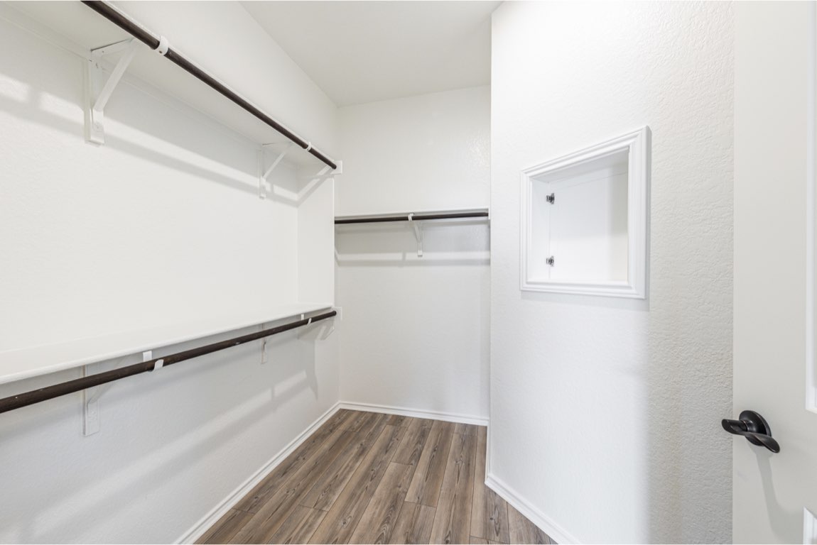 201 Coachsmith Street Georgetown, TX 78633 - Photo 23 of 32 a view of small space with racks on the wall