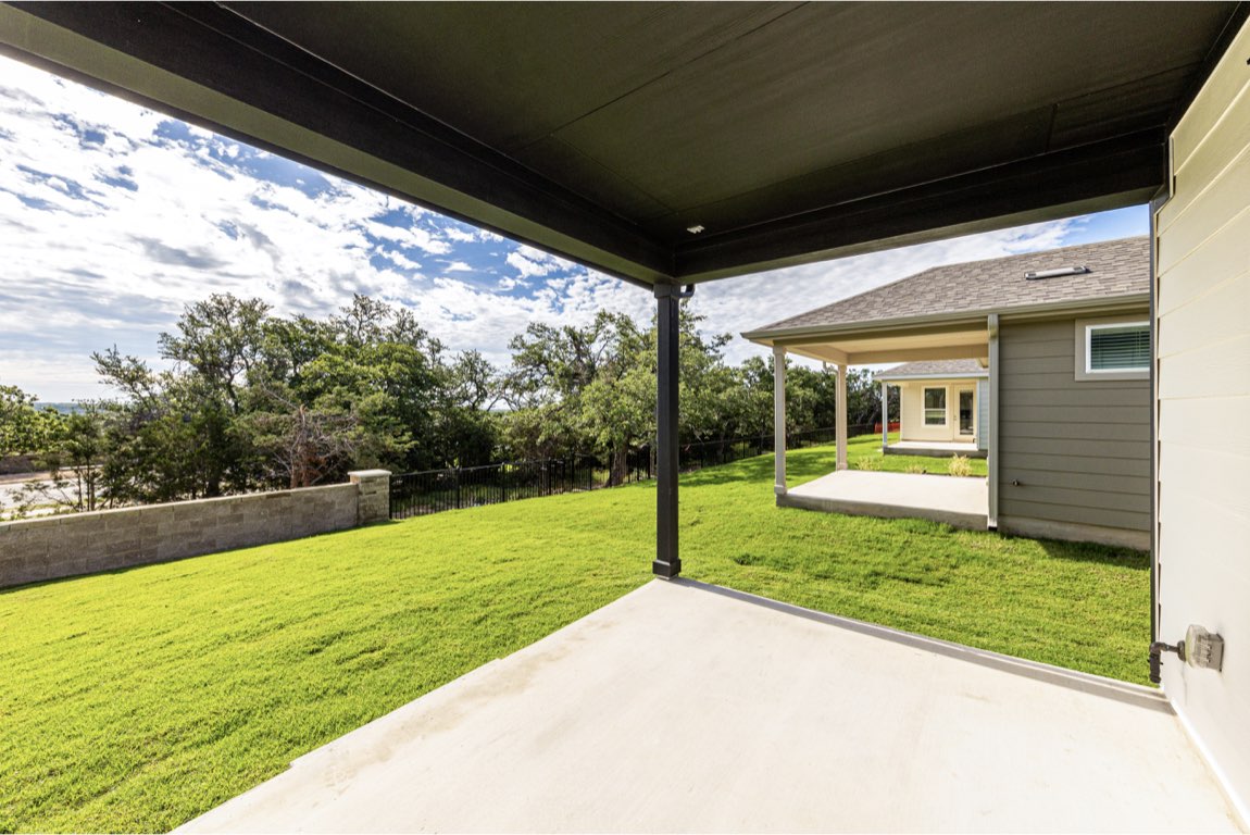 201 Coachsmith Street Georgetown, TX 78633 - Photo 26 of 32 a view of a porch and garden