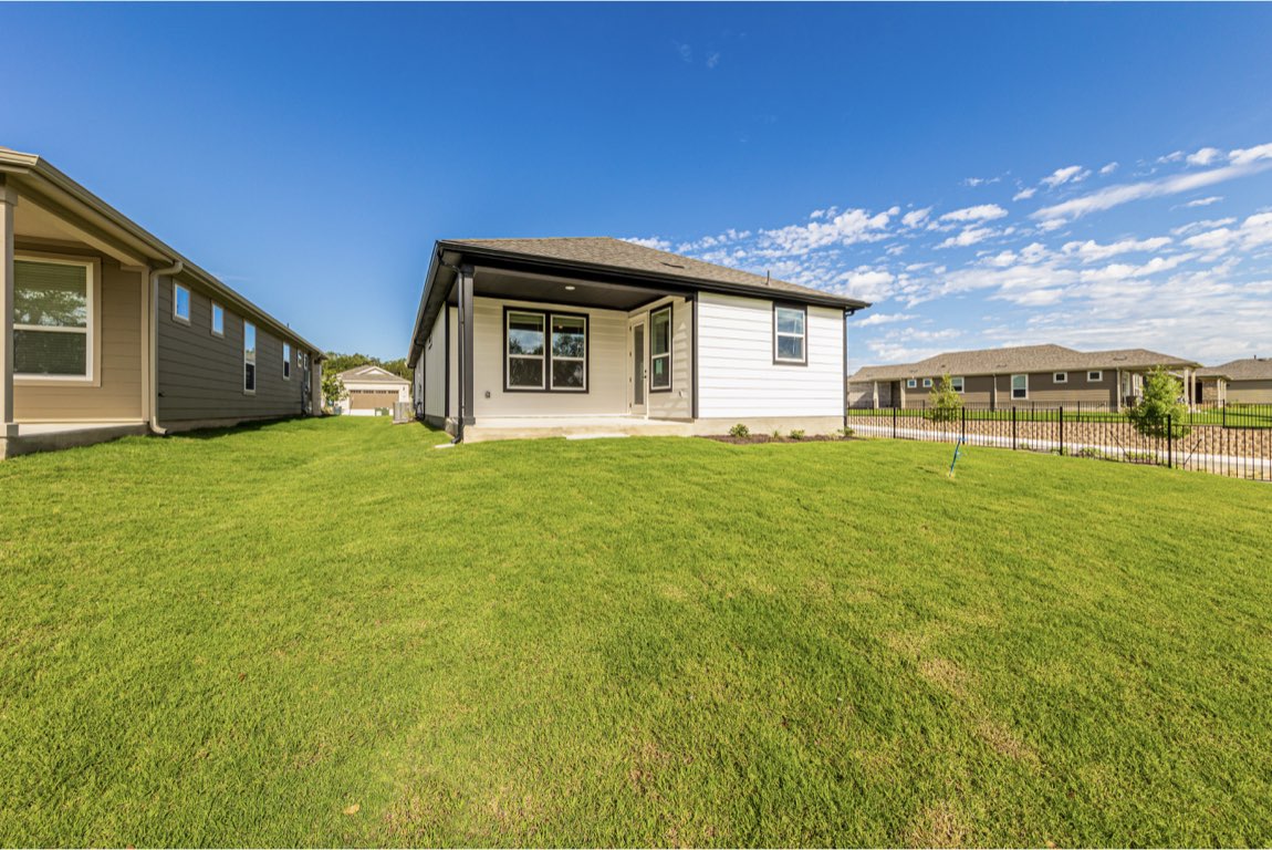201 Coachsmith Street Georgetown, TX 78633 - Photo 28 of 32 a big house with an outdoor space