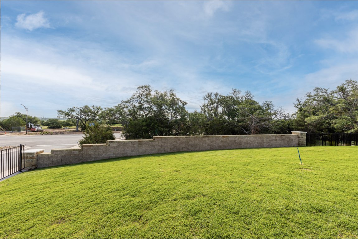 201 Coachsmith Street Georgetown, TX 78633 - Photo 30 of 32 a view of a swimming pool and a yard