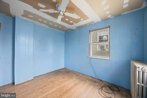 a view of a room with a wooden floor