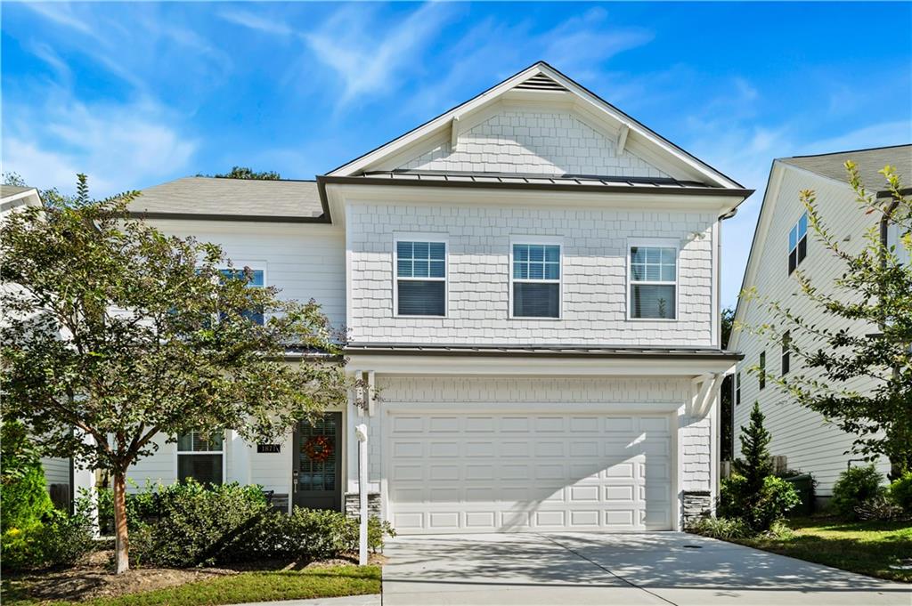 a front view of a house with garden