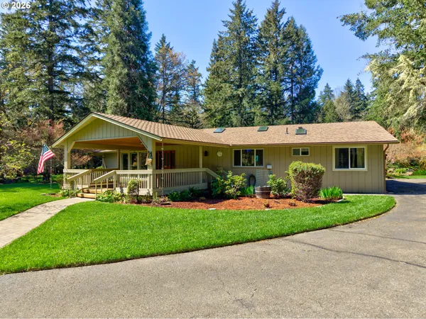 a front view of house with yard and green space