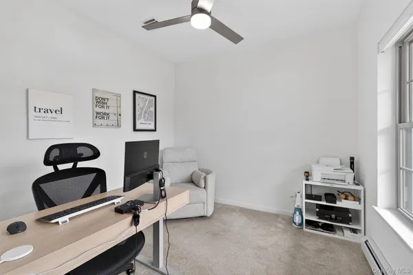 a bathroom with a sink mirror and toilet