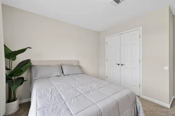 a bed room with a bed and a chandelier