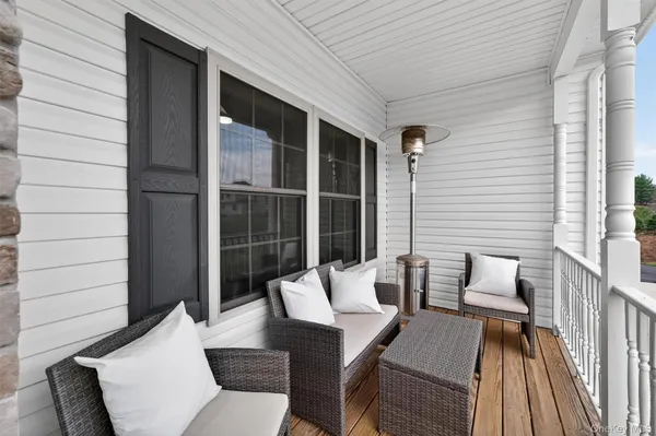 a view of entryway with wooden floor and stairs