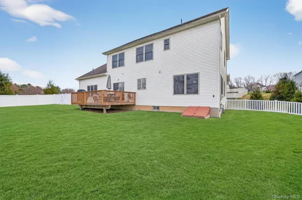 a front view of a house with a garden and yard