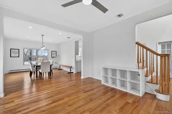 a view of a dining room with furniture and wooden floor