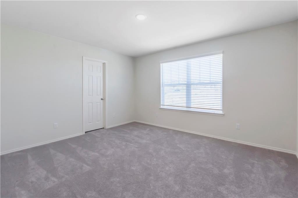 338 Pepperbark Loop Buda, TX 78610 - Photo 15 of 23 an empty room with windows