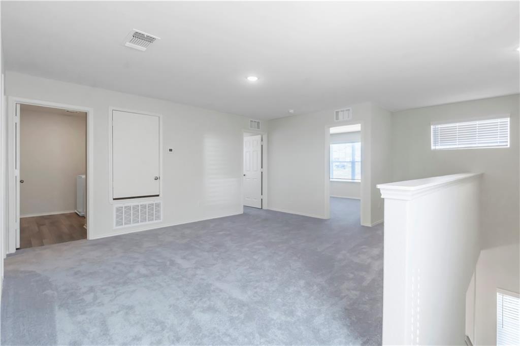 338 Pepperbark Loop Buda, TX 78610 - Photo 20 of 23 a view of an empty room and a window