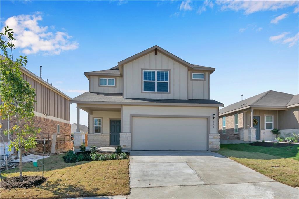 338 Pepperbark Loop Buda, TX 78610 - Photo 2 of 23 a front view of a house with garden