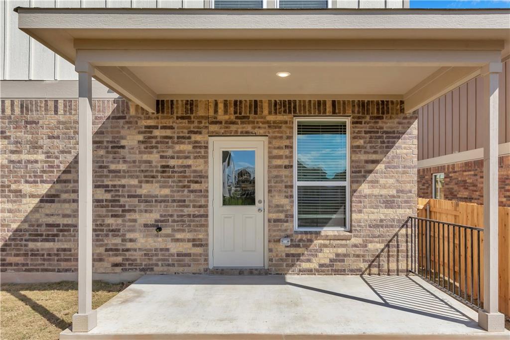 338 Pepperbark Loop Buda, TX 78610 - Photo 22 of 23 a front view of a house with a porch