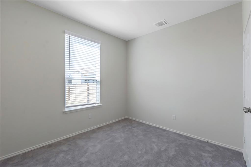 338 Pepperbark Loop Buda, TX 78610 - Photo 9 of 23 an empty room with a window