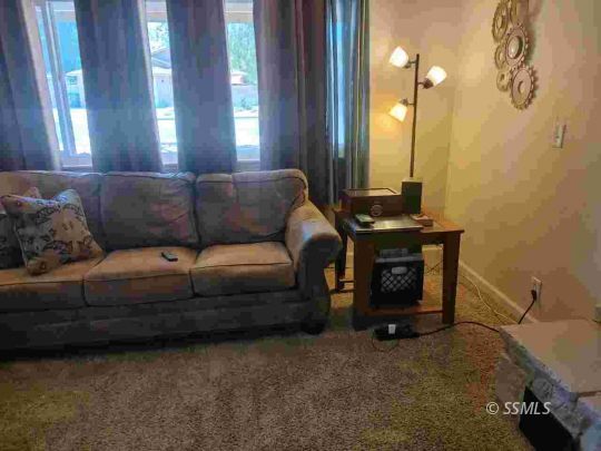 421 South Valley Street Ridgecrest, CA 93555 - Photo 5 of 20 a living room with furniture and a fireplace