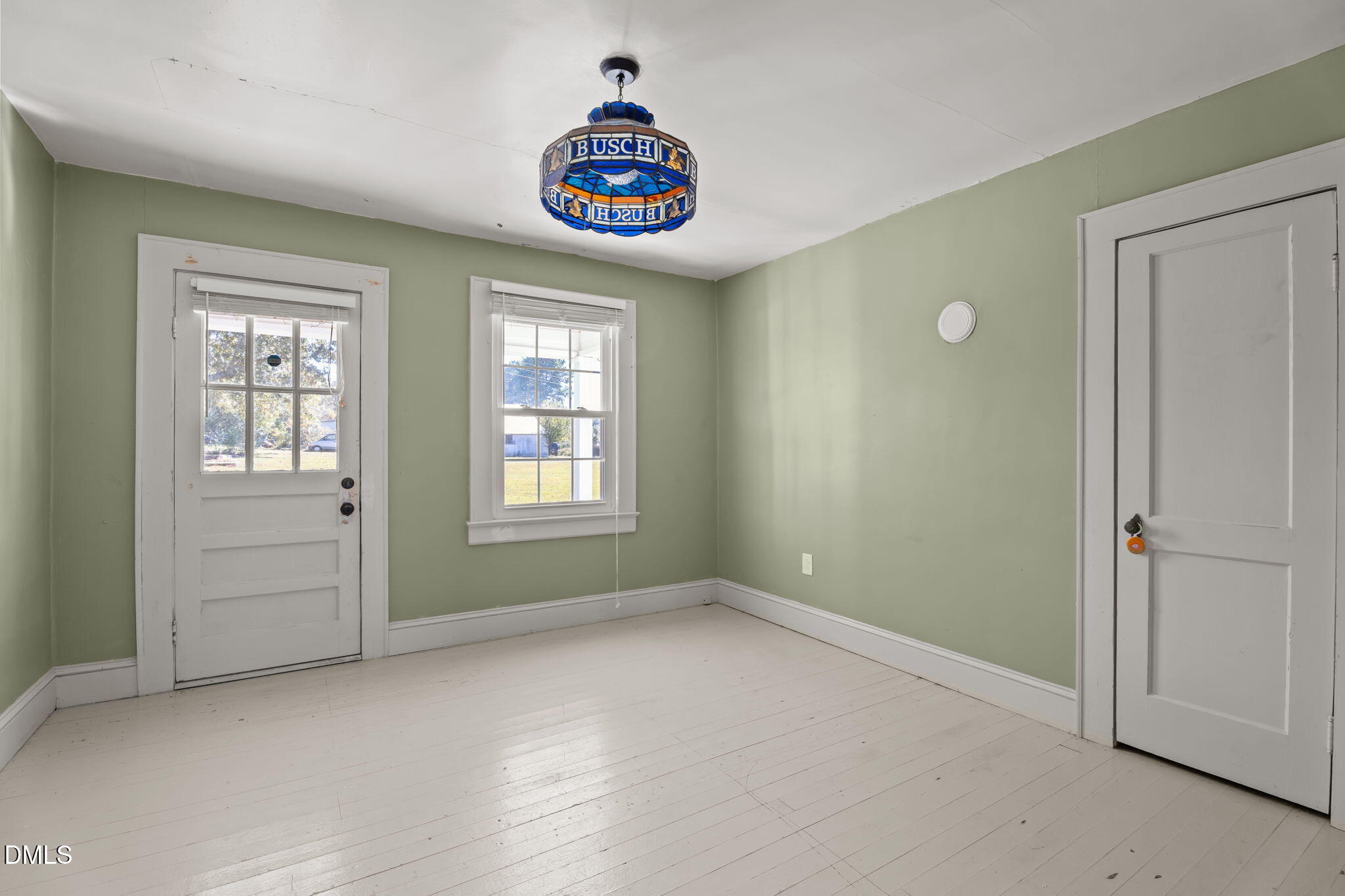 7477 Highway 58 Castalia, NC 27816 - Photo 23 of 43 an empty room with windows and cabinet