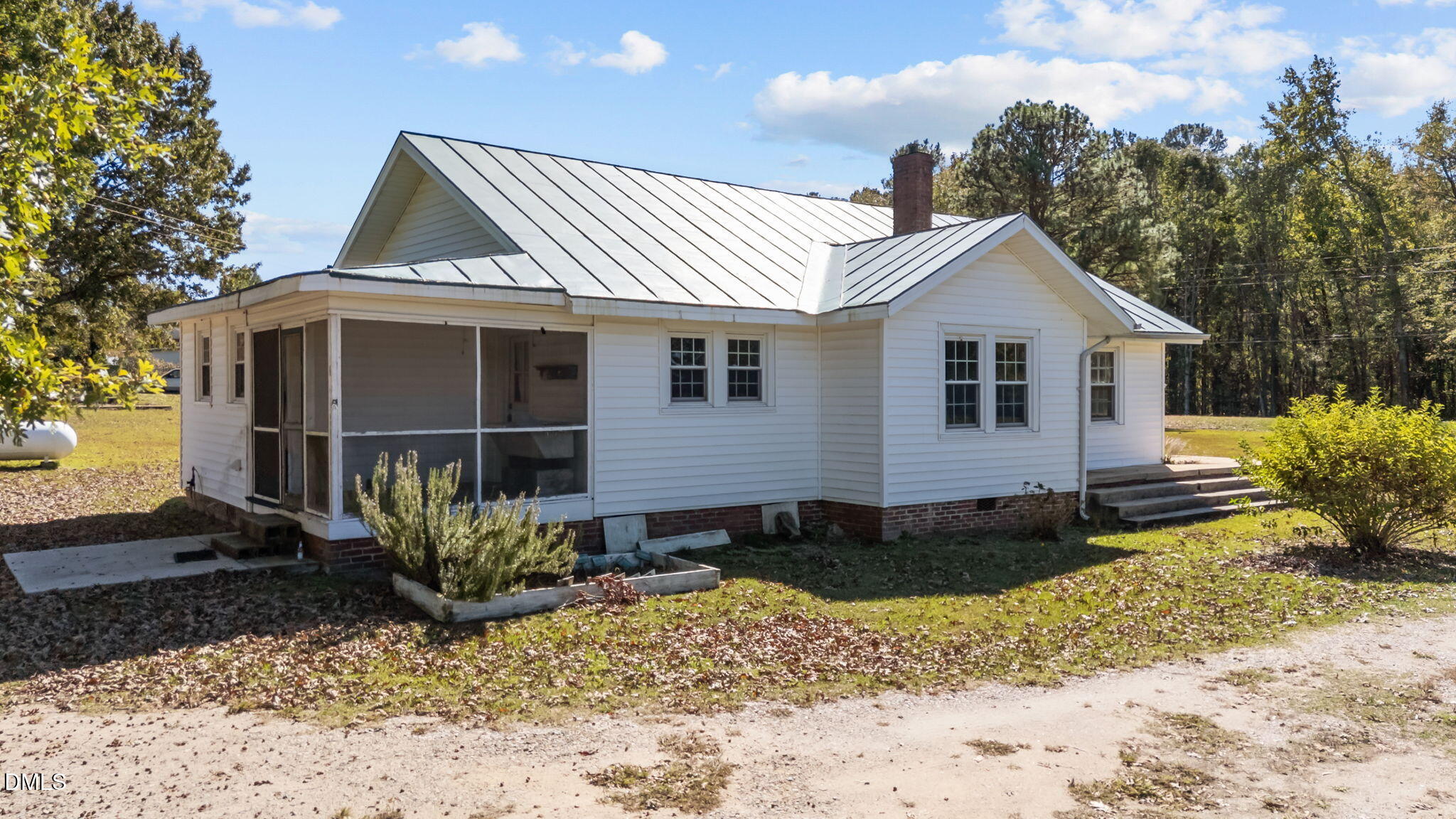 7477 Highway 58 Castalia, NC 27816 - Photo 6 of 43 a view of a house with a yard and potted plants