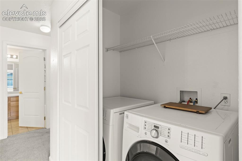 1563 Monterey Road, Unit D Colorado Springs, CO 80910 - Photo 15 of 22 a view of livingroom with washer and dryer