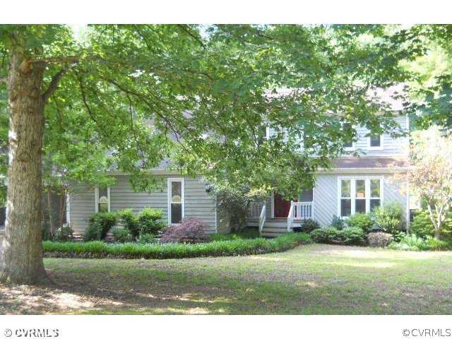 1100 Castle Hollow Road Midlothian, VA 23114 - Photo 1 of 8 a front view of a house with a yard