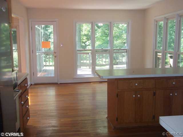 1100 Castle Hollow Road Midlothian, VA 23114 - Photo 2 of 8 a view of an empty room with wooden floor and a window