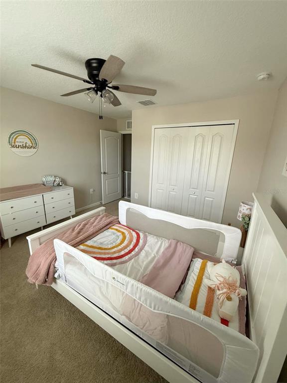 311 Redbud Road Palm Coast, FL 32137 - Photo 11 of 27 a living room with furniture and a rug