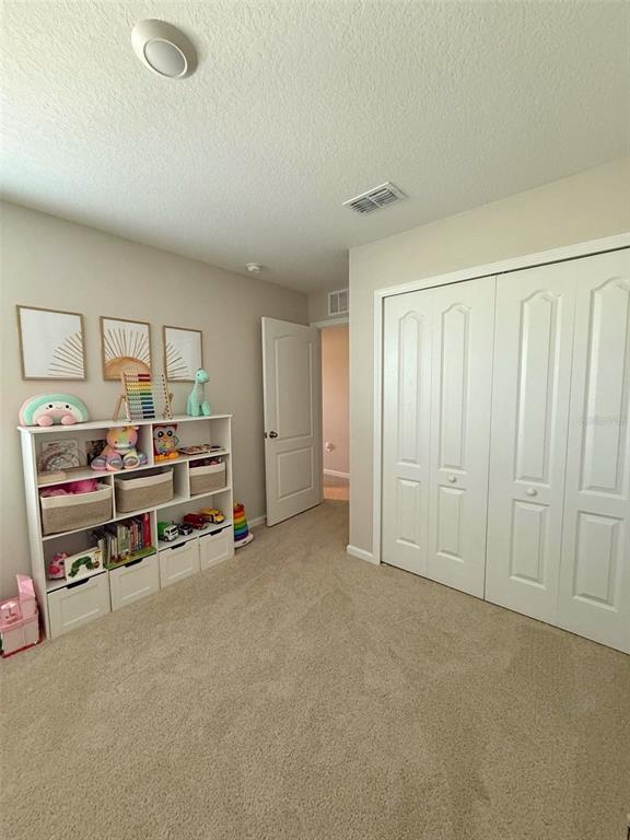 311 Redbud Road Palm Coast, FL 32137 - Photo 13 of 27 a view of a livingroom with furniture and a window