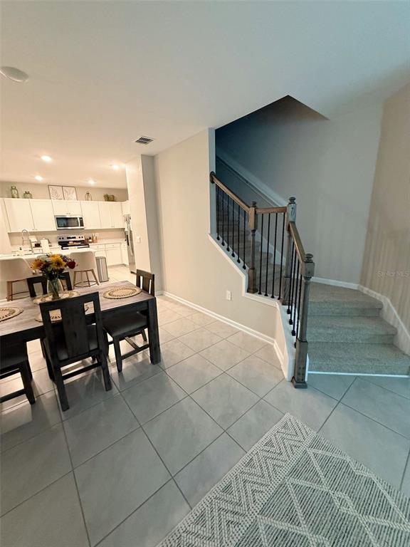 311 Redbud Road Palm Coast, FL 32137 - Photo 15 of 27 a view of a dining room with furniture