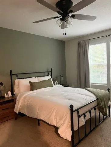 a view of a bedroom with a bed and closet