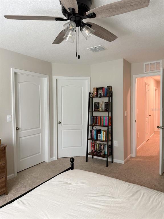 311 Redbud Road Palm Coast, FL 32137 - Photo 17 of 27 a view of a bedroom with a bed and closet
