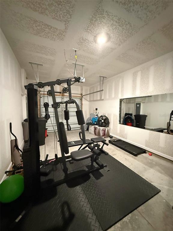 311 Redbud Road Palm Coast, FL 32137 - Photo 25 of 27 a view of a room with gym equipment