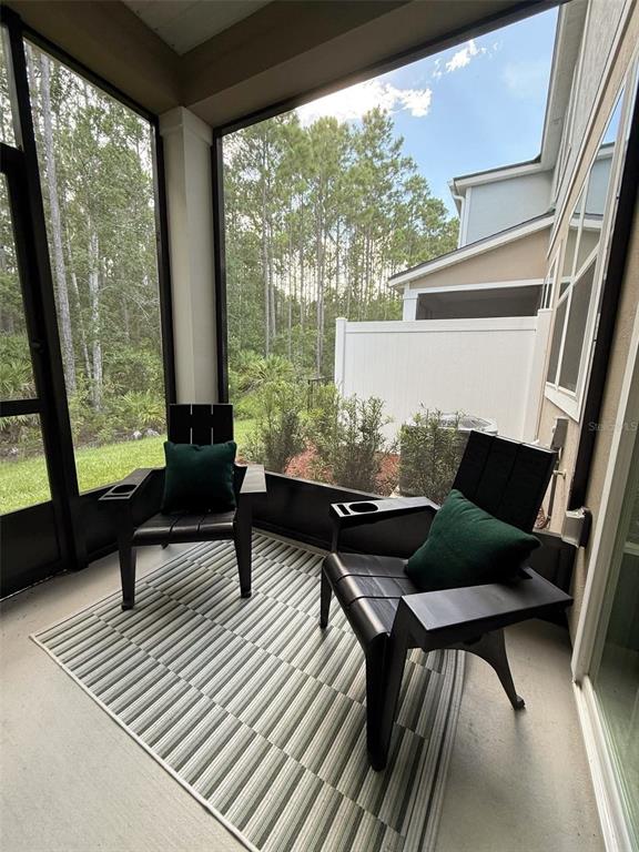 311 Redbud Road Palm Coast, FL 32137 - Photo 27 of 27 a living room with furniture and a window