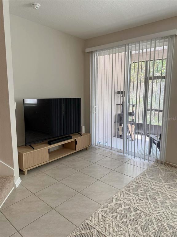 311 Redbud Road Palm Coast, FL 32137 - Photo 6 of 27 a view of an empty room with furniture and a window