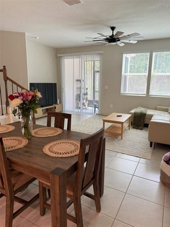 311 Redbud Road Palm Coast, FL 32137 - Photo 7 of 27 a view of a dining room with furniture and window
