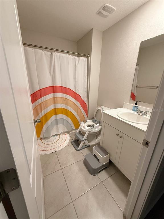 311 Redbud Road Palm Coast, FL 32137 - Photo 9 of 27 a bathroom with a sink and a mirror